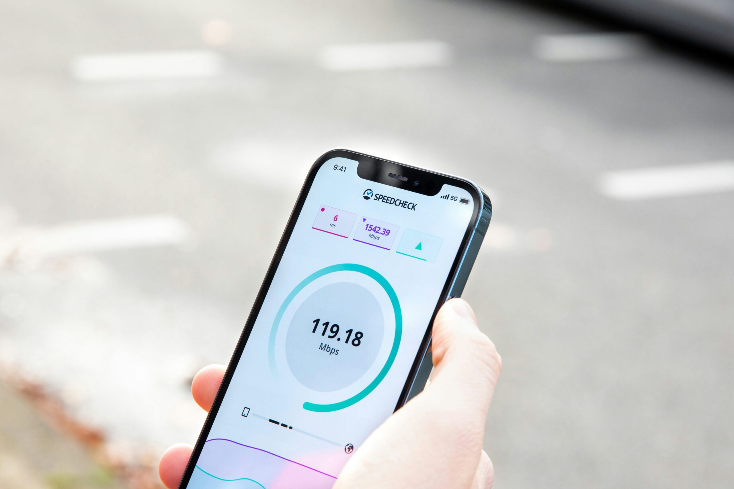 person-showing-speed-test-on-phone A person showing pocket wifi speed test results on their phone screen