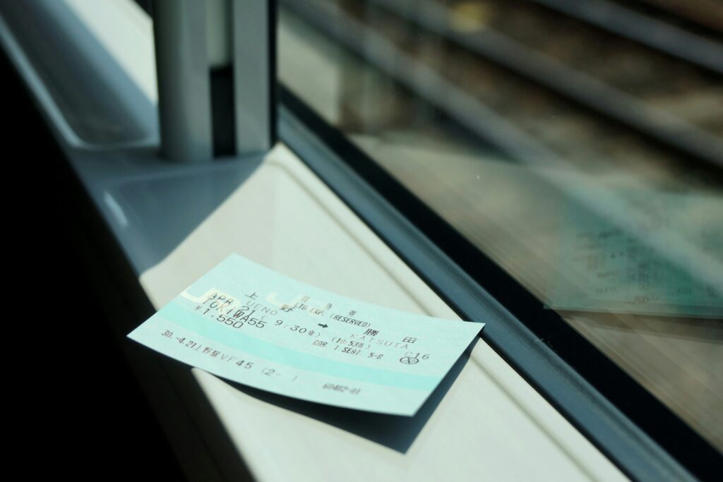 shinkansen-ticket A shinkansen ticket rests on the window sill of a train.